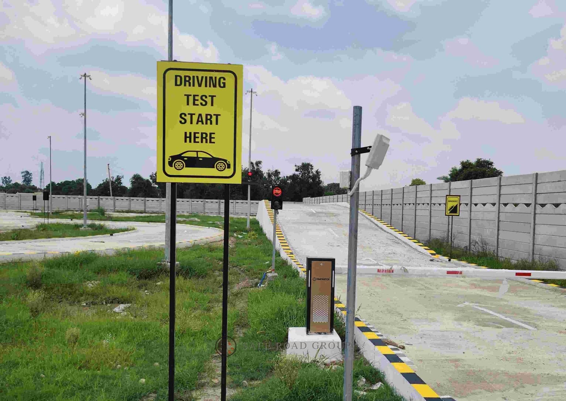 The start of the driving test lane, the boom barrier and the sensor post beside it